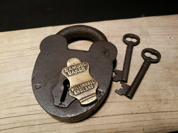 Cast Iron Padlock Lock & Key: 5 1/2" tall x 4 1/8" Wide Nice reproduction cast iron padlock! This lock is fully functional! Hard to tell its age. Heavy iron and brass. Great aged patina throughout. Limited quantity available! All 