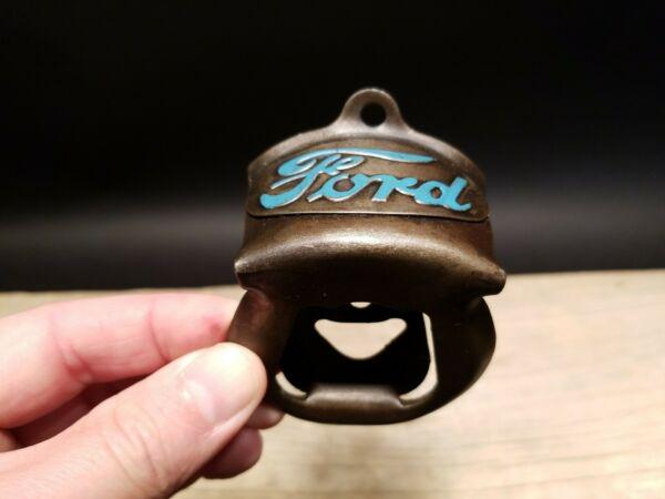 Ford Beer Bottle Cap Opener: 3 1/4" tall x 2 3/8" wide Wonderful Ford motors wall mount bottle cap opener. Well made all metal opener comes with mounting screws! All our items come with a 100% customer satisfaction guarantee. Abo
