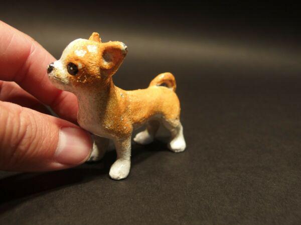 Miniature Cast Iron Chihuahua Dog: 2 5/8" Long x 2 1/2" Tall Great little reproduction cast iron chihuahua dog. All cast iron hand painted, slightly distressed as shown in the images. Certainly looks old! See our other miniature cast i