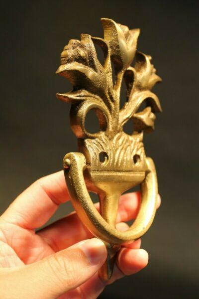 Brass Floral Door knocker: 6 1/2" Tall x 3 1/2" Wide x 1" ExtensionGreat reproduction floral door knocker cast from an antique. Really great authentic looking detail and slight antique patina. This piece is in natural brass so 