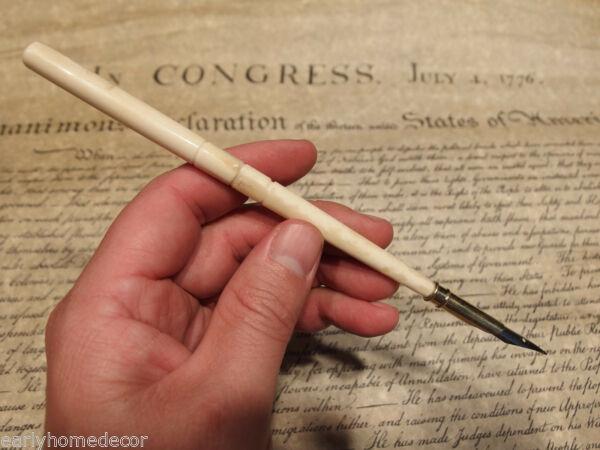 Turned Bone Calligraphy Inkwell Ink Dipping Pen: 7 1/2" Long Great reproduction of an antique turned bone dipping pen. Made from natural bovine cattle bone. This piece accommodates the included removable metal tip. And finely turned bone handle. Cer