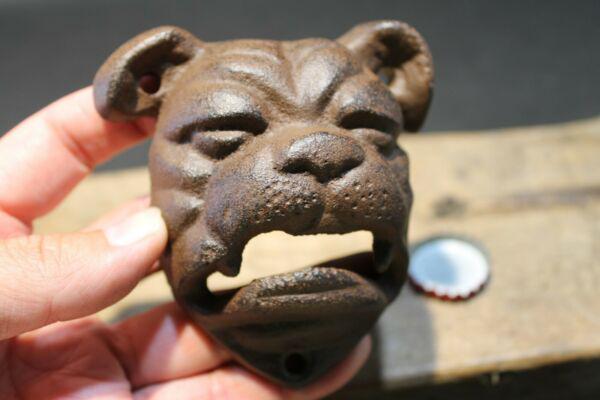 Cast Iron wall mount folk art Bulldog Beer Bottle: 4" Tall x 3 1/2" Wide Such a neat reproduction antique cast iron bulldog wall mounted bottle cap opener. The mouth of the bulldog is where you would open the bottle. Certainly a great accent piece! Be