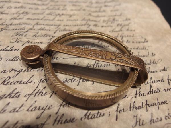 Brass Pocket Folding Optical Glass Magnifying Lens: 3" at its longest closed ...5 1/4" at its longest open Nice reproduction of an antique brass flip out Magnification glass or lens. Magnifying glasses like this were used in the 18th and 19th century d