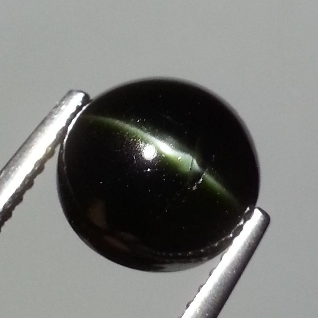 Natural Kornerupine Cat's Eye 3.99 ct: No Reserve! Title: Natural Kornerupine Cat's Eye 3.99 ct Color/Clarity: Opaque Gemstones: Loosegemstone Carat Weights: 3.99 Size/Dimensions: 9.20 x 9.20 x 5.30 Additional Information: Round - Srilanka