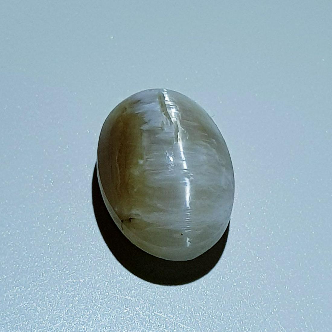 7.30 ct Natural Opal Cat's Eye: No Reserve! Title: 7.30 ct Natural Opal Cat's Eye Color/Clarity: Semi Transparent Gemstones: Loosegemstone Carat Weights: 7.3 Size/Dimensions: 13.70 x 10.40 x 9.20 Additional Information: Oval - Afric