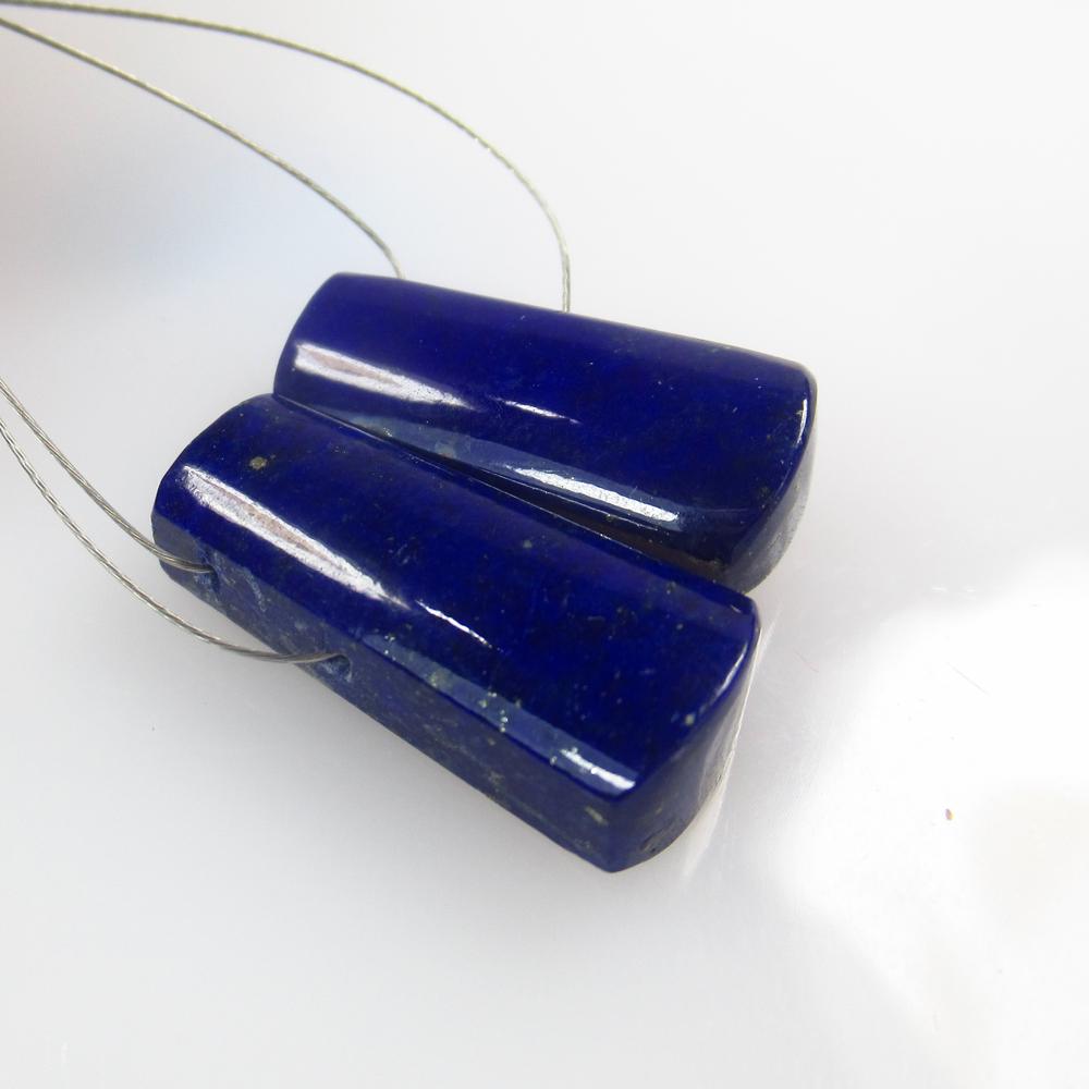 23.71 Ctw Natural Blue Lapis Lazuli Fancy Cab: No Reserve! Title: 23.71 Ctw Natural Blue Lapis Lazuli Fancy Cab Stone Clarity: 23.71 Gemstone: Lapis Lazuli Size/ Dimensions: 23.71 Carat Weights:20.00 x 8.50 x 5.00 mm Additional Info: Drilled Fancy