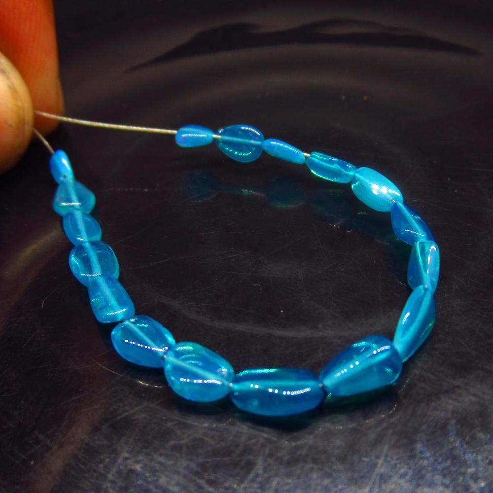 4.08 Ctw Natural 17 Drilled Neon Blue Fire Opal Beads: No Reserve! Title: 4.08 Ctw Natural 17 Drilled Neon Blue Fire Opal Beads Stone Clarity: Transparent Gemstone: Opal Beads Carat Weight: 4.08 Size/Dimensions: 4.0x2.9 to 7.0x3.4 mm / 17 PC's Additional 