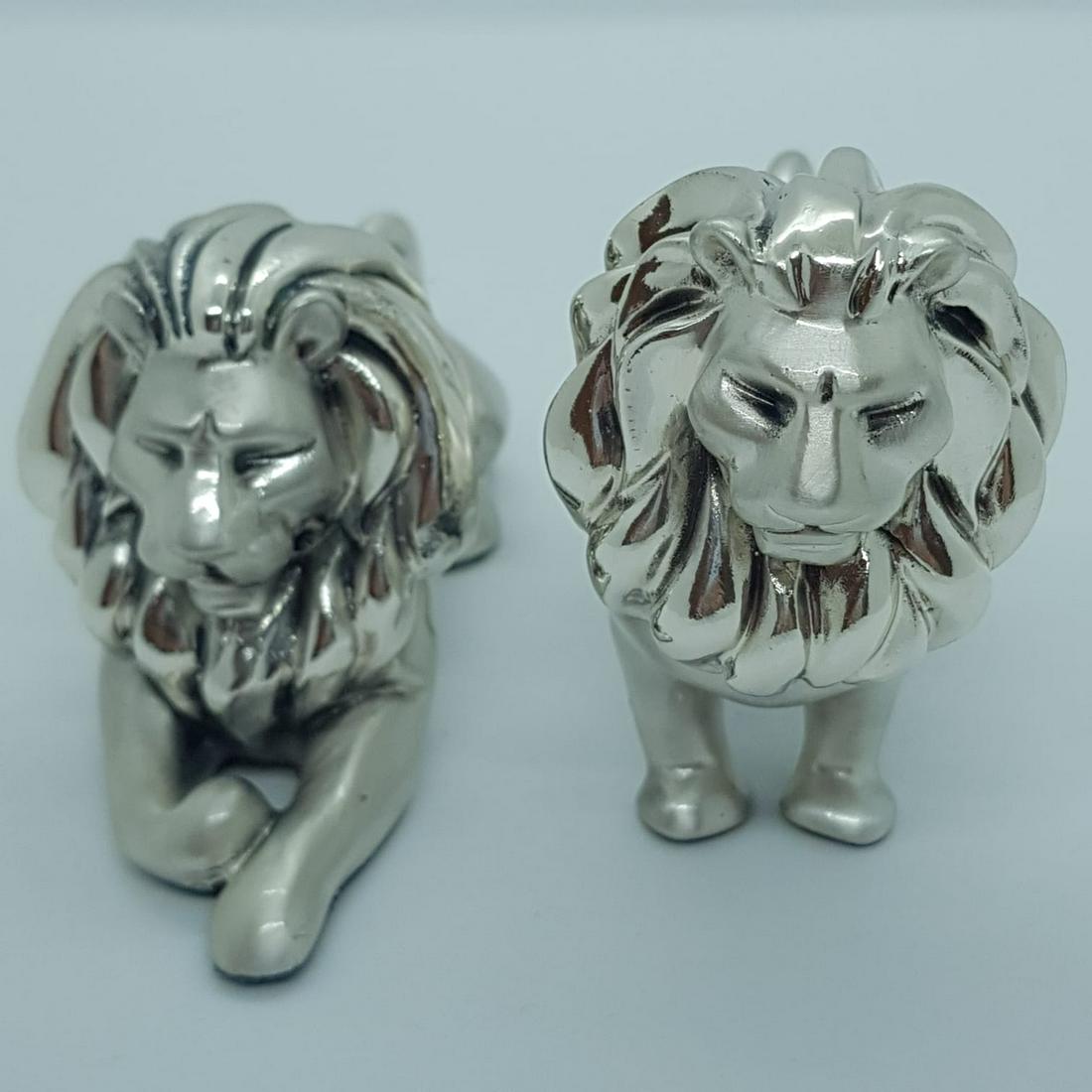 925 Silver Plated Lion statue: Title: 925 Silver Plated Lion statue Size/Dimensions: Sizes: 3.1x2.5 inch and 4.3x1.9 inch Material: Polyster Silver Plate Date/Period:2020 Description: 925 Silver Plated Lion Statue. Lion sizes: 3.1x