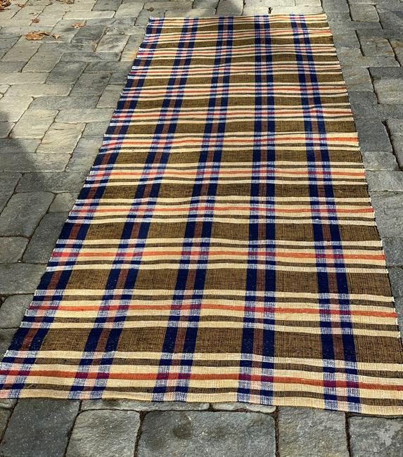 c. 1940 (Unused) Rag Carpet: Title: c. 1940 (Unused) Rag Carpet Description: Bold, powerful, honey, tans, soft blues and red in a complex patterning demonstrating the skill of the weaver. Dimension: 10 ft. 6 in. x 39 5/8 in. Circ