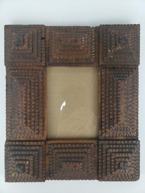 Tramp Art Frame: Title: Tramp Art Frame Date/Period: early 1900s Materials: wood Dimensions: 11 1/4" x 9" 3/4", window holds 7 3/8" x 4 1/2" Description: A nicely detailed multi-layer tramp art frame.nice, naturally a