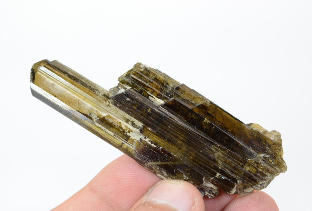39 Gram Lustrous Rare Natural Epidote Crystal: Title: 39 Gram Lustrous Rare Natural Epidote Crystal Weight: 39 Gram Size/Dimensions: 79x24x13 mm Origin: Pakistan Reserve: $30.00 Shipping: Domestic: Flat-rate of $15.00 to anywhere within the contig