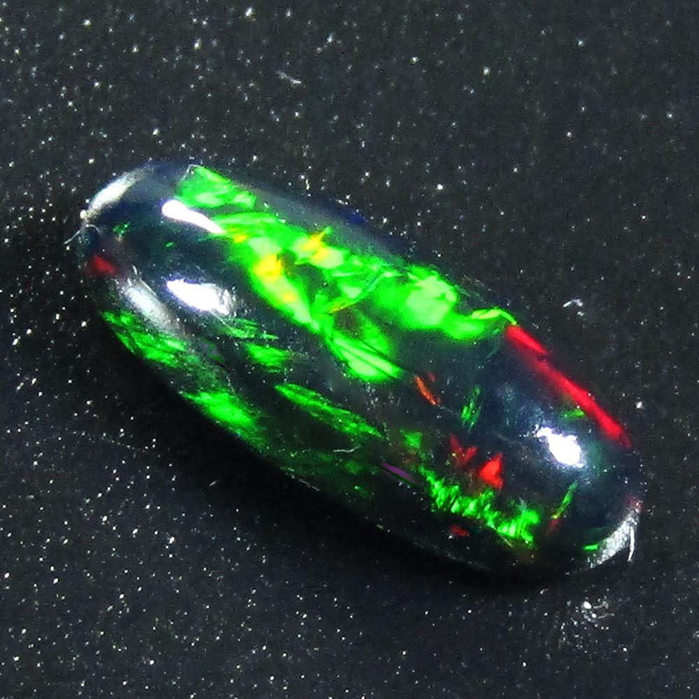 1.00Cts Natural Multi color Black Opal Oval Cabochon: Title: 1.00Cts Natural Multi color Black Opal Oval Cabochon Good Luster loose gemstone Carat Weights: 1 Size/Dimension: 10.70x4.70x3.10 MM Additional Info: HEATED WITH PLAY OF COLOR Reserve: $10.00 Sh