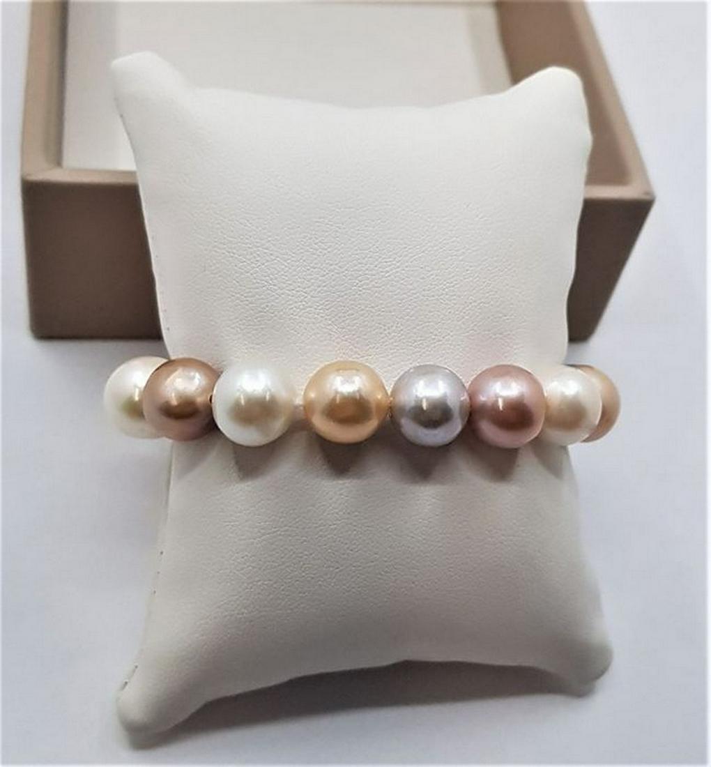 11x14mm Multi Edison Freshwater pearls - Bracelet: Description: Most freshwater pearls are nucleated by tissue, but Edison cultured pearls are nucleated with beads, exactly as saltwater pearls This luxurious bracelet contains Edison Pearls which were 