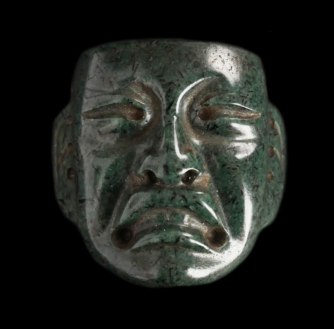 Olmec Pendant: Title: Olmec Pendant Description: Pre-Columbian, Southern Mexico. 1000 to 400 BCE. A mesmerizing maskette carved from a beautiful greenstone created by the Olmec, the oldest major civilization in Mexi