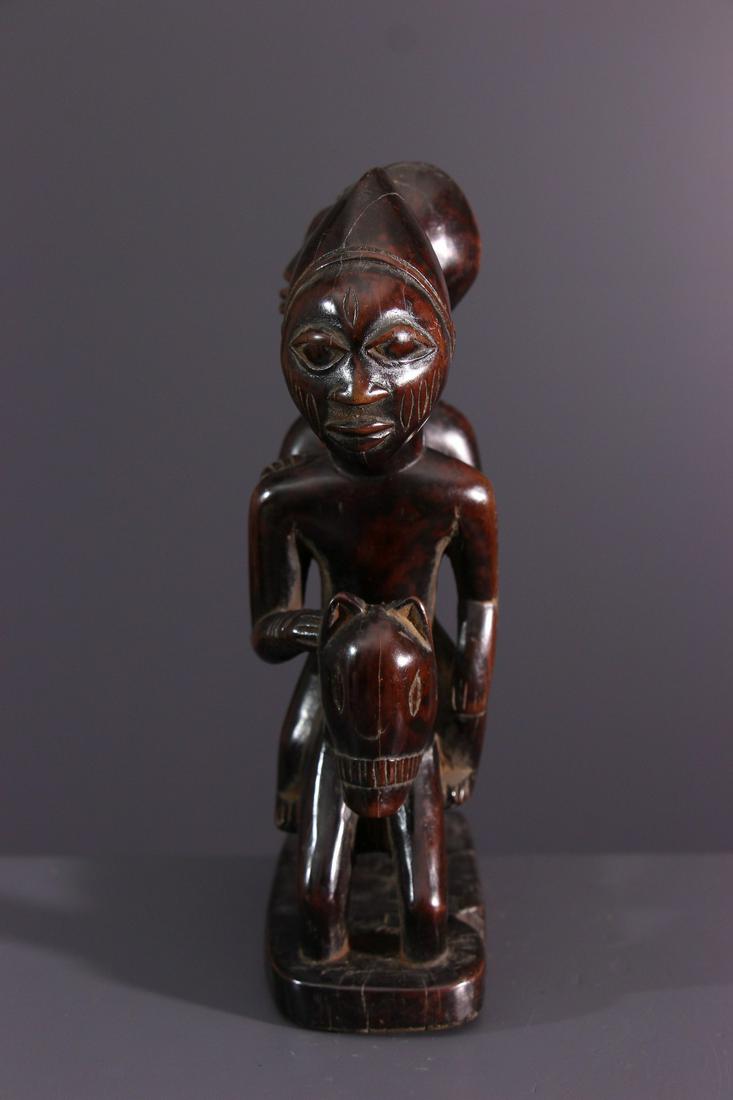 Yoruba rider wood figure - Nigeria - African Art Tribal: Title: Yoruba rider wood figure - Nigeria - African Art Tribal Art Description: This figure of a rider glorifies a deified ancestor. The equine, rare in the region, was also an attribute of prestige t