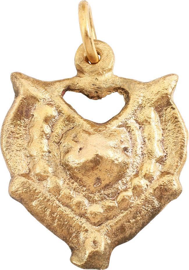VERY FINE VIKING HEART NECKLACE C.950-1050 AD: C. 950-1050 AD. 7/8" height, intricately detailed. Central raised heart with a beaded border below a pierced heart. Two hearts within a heart! The broadly rounded edges with nubs at the sixth points. 