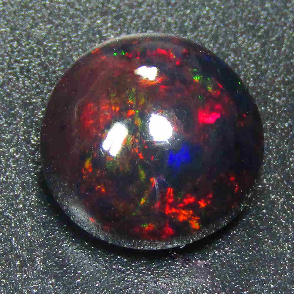 3.10Cts Natural Multi color Black Opal RoundCabochon: Title: 3.10Cts Natural Multi color Black Opal RoundCabochon Good Luster loose gemstone Carat Weights: 3.1 Size/Dimensions: 10.00x10.00x6.60 MM Additional Information: VVS QUALITY HEATED WITH PLAY OF C