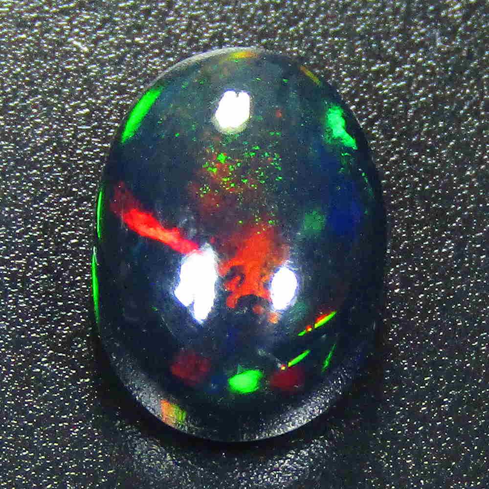 1.60Cts Natural Multi color Black Opal Oval Cabochon: Title: 1.60Cts Natural Multi color Black Opal Oval Cabochon Good Luster loose gemstone Carat Weights: 1.6 Size/Dimensions: 9.20x7.40x4.70 MM Additional Information: VVS QUALITY HEATED WITH PLAY OF COL