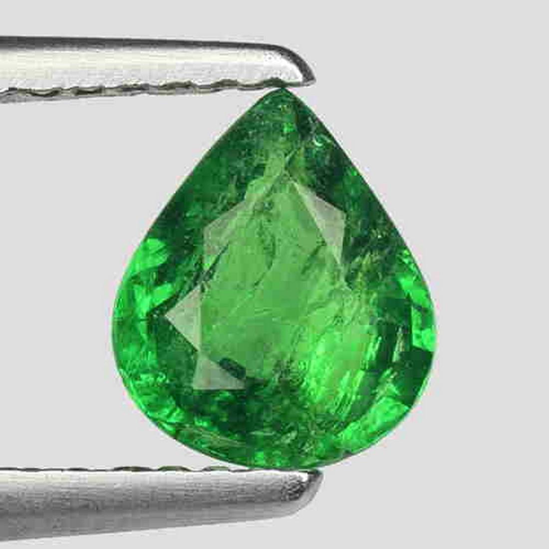 0.95 CTS MARVELOUS PEAR 100% NATURAL TSAVORITE GARNET: Title: 0.95 CTS MARVELOUS PEAR 100% NATURAL TSAVORITE GARNET LOOSE GEMSTONES NL166 Carat Weights: 0.95 Size/Dimensions: 6.70 x 5.50 x 2.9 MM Additional Information: VS QUALITY Reserve: $25.00 Shipping