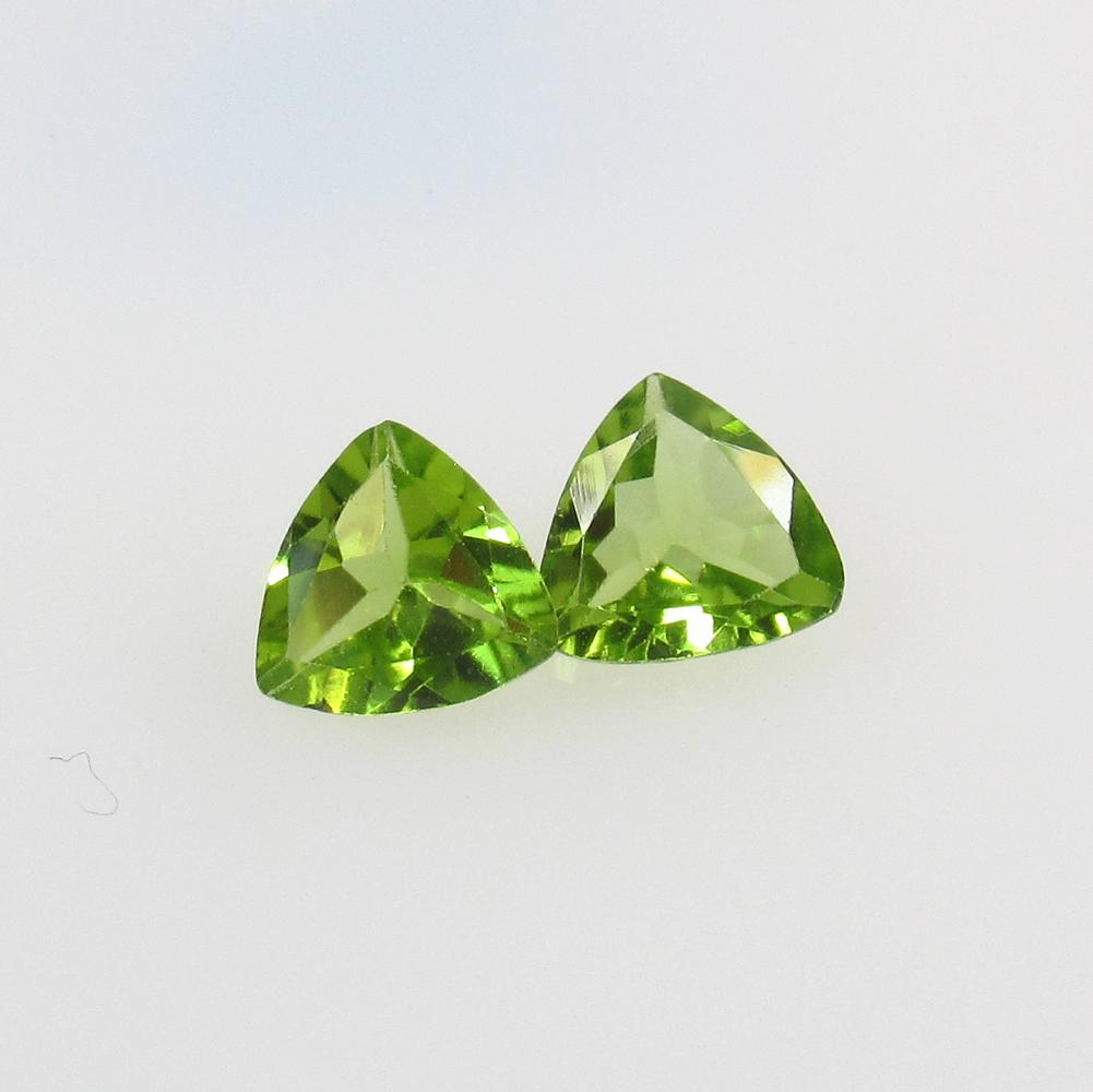 1.93 Ct Natural Pakistan Peridot Trillion Pair: No Reserve! Title: 1.93 Ct Natural Pakistan Peridot Trillion Pair Stone Clarity: VVS Gemstones: Natural Peridot Carat Weights: 1.93 Size/Dimensions: 7.00 x 7.00 x 3.50 mm / 2 PC's Additional Informati