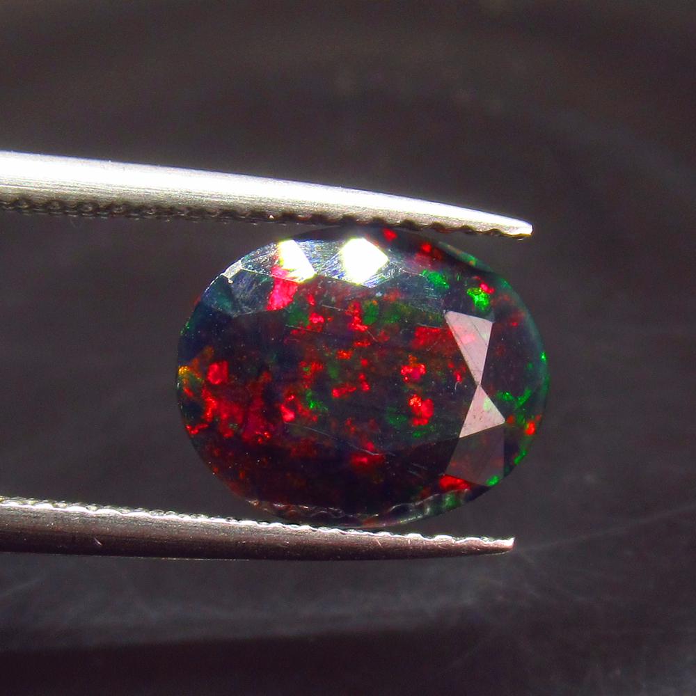 1.57 Ct Natural Ethiopian Black Faceted Fire Opal Oval (1 of 2)