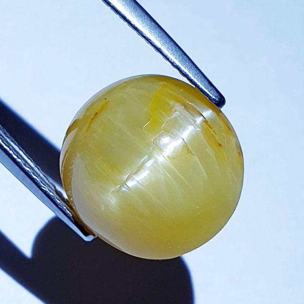 9.33 ct Natural Opal Cat's Eye: No Reserve! Title: 9.33 ct Natural Opal Cat's Eye Color/Clarity: Semi Transparent Gemstones: Loosegemstone Carat Weights: 9.33 Size/Dimensions: 13.60 x 13.10 x 8.90 Additional Information: Round - Afr