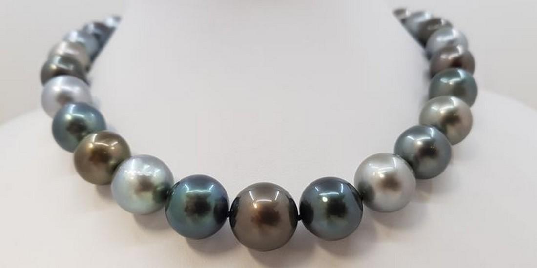 18 kt. White Gold - Large 12x15.2mm Round Multi: Title: 18 kt. White Gold - Large 12x15.2mm Round Multi Tahitian Pearls - Necklace Description: Grown in the black-lipped Pinctada margaritifera oyster in the tropical waters of French Polynesia, these