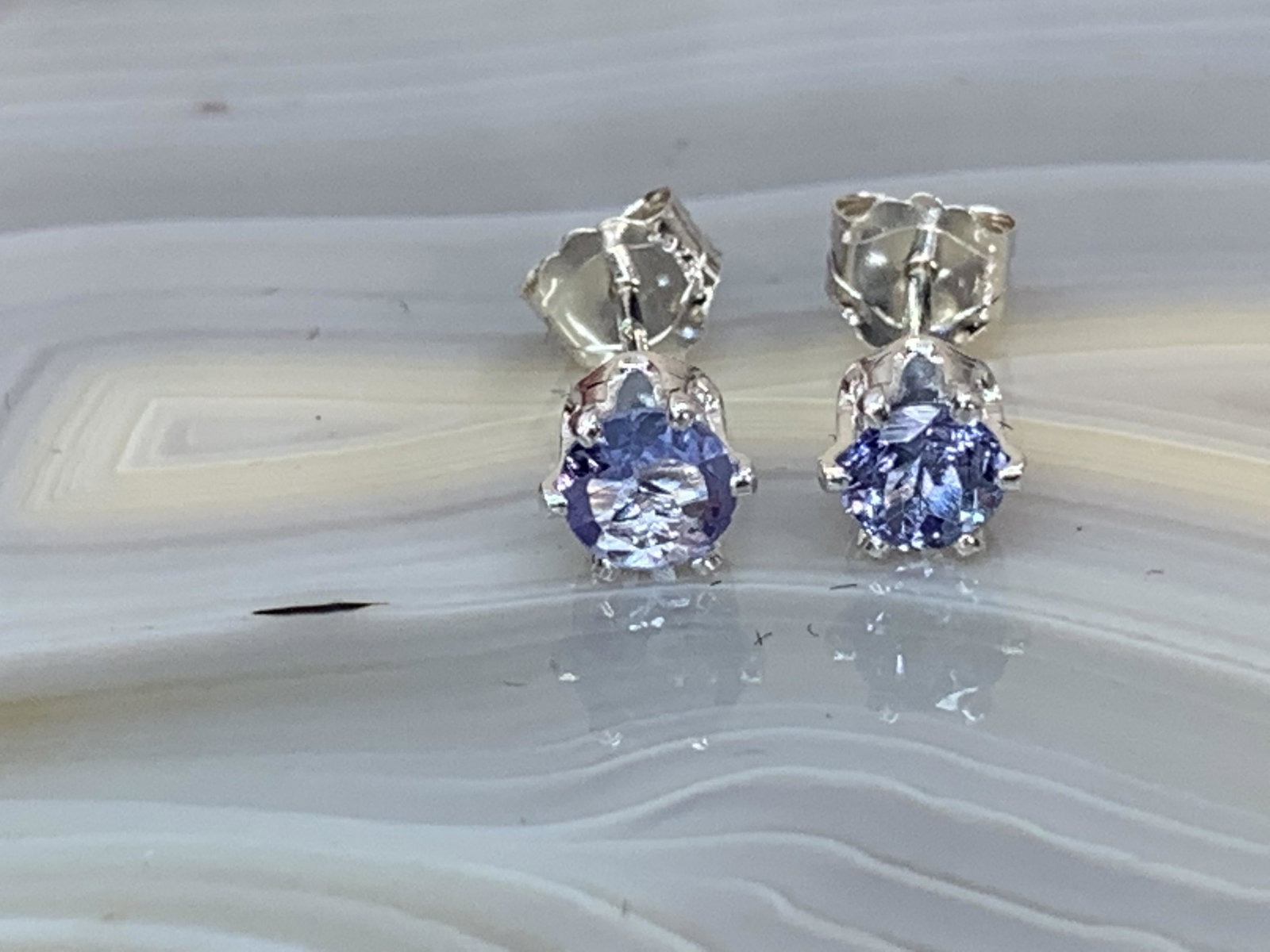 Tanzanite Natural Gemstone .925 Sterling Earrings: No Reserve! Title: Tanzanite Natural Gemstone .925 Sterling Earrings Materials:Sterling Silver Dimensions: 4 mm Shipping: Domestic: Flat-rate of $7.00 to anywhere within the contiguous U.S. Internatio