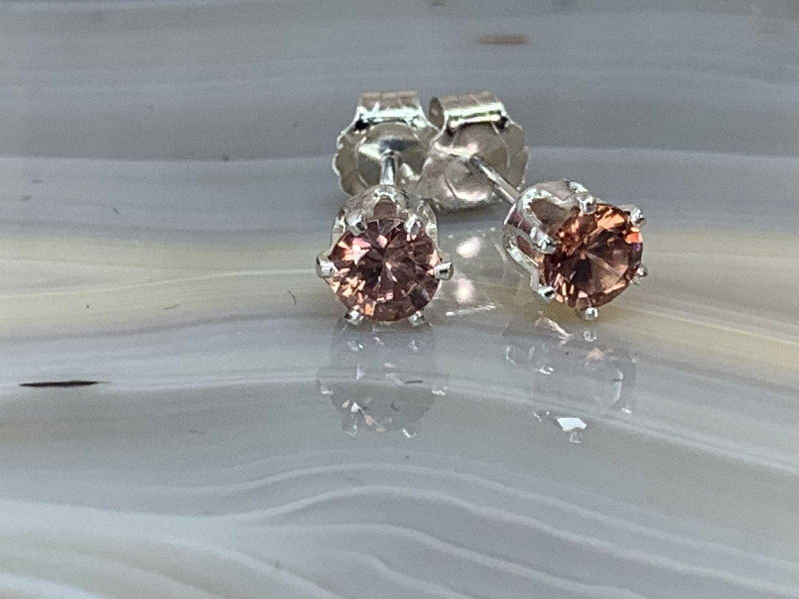 Cinnamon Zircon Natural Gemstone .925 Sterling Earrings: No Reserve! Title: Cinnamon Zircon Natural Gemstone .925 Sterling Earrings Materials:Sterling Silver Dimensions: 4 mm Shipping: Domestic: Flat-rate of $7.00 to anywhere within the contiguous U.S. Inte