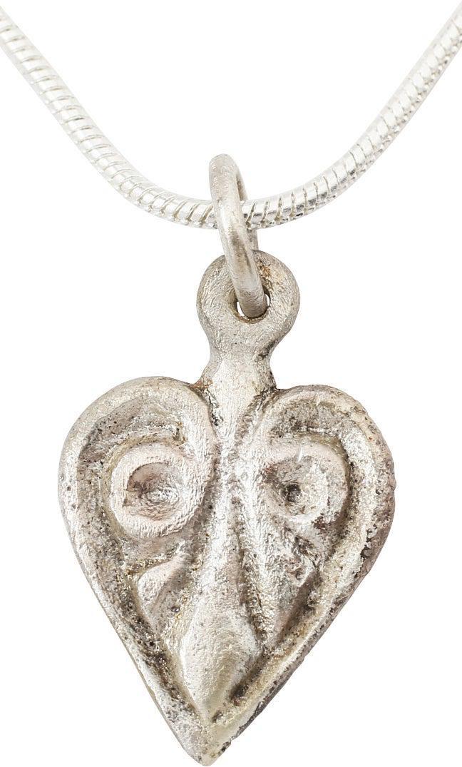 FINE VIKING HEART NECKLACE, 10TH-11TH C. AD: 3/4” height, intricately detailed. Cusped shape heart with an intricate variation on the trefoil with scrolling top and triple bottom stems. Made by the open face mold technique. For Vikings, th