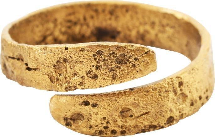 ANCIENT VIKING COIL RING C.900-1050 AD SZ 11: Size 11. Gilt bronze. Broad flat band with medial stipple decoration. 5.1mm, in 1 1/8 coils. The coil or helix was a favorite form for Vikings and evidently held supernatural significance to them. Tex