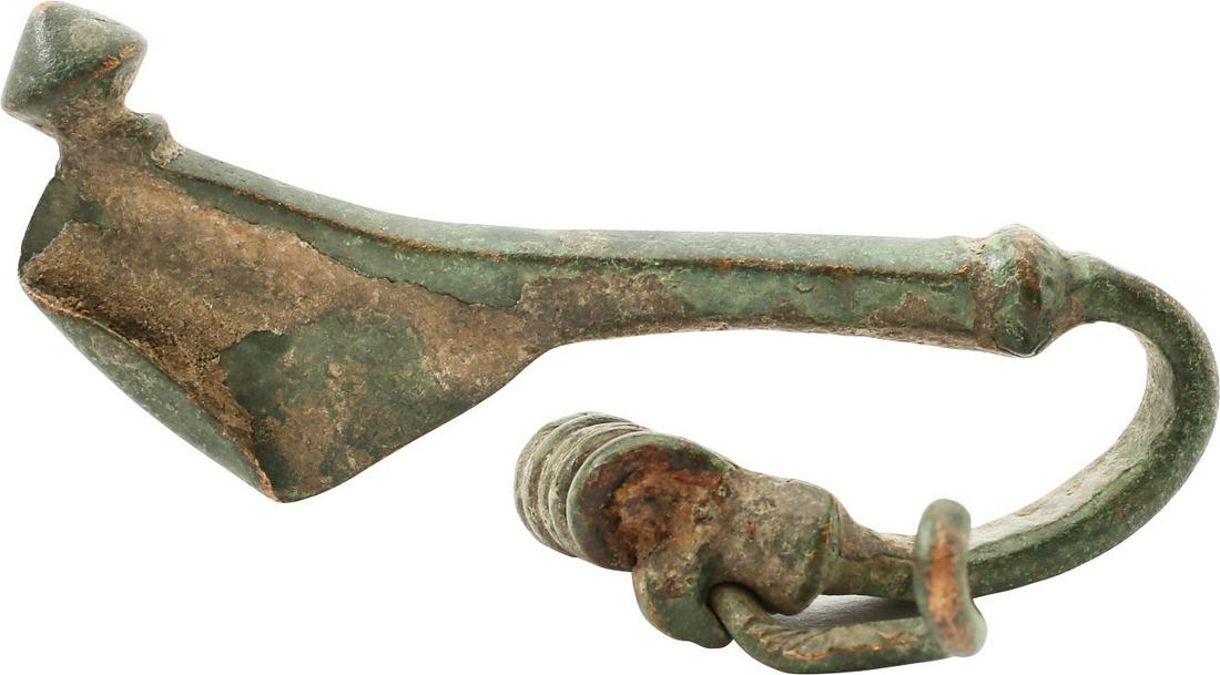 ROMAN FIBULA, 1st-3rd CENTURY AD: No Reserve! The time of Christ. Brass, arch from with transverse back crest and open pin rest. 2 3/8” length. Elegant form. The original garment pin patented 2 millennia later as the “safe