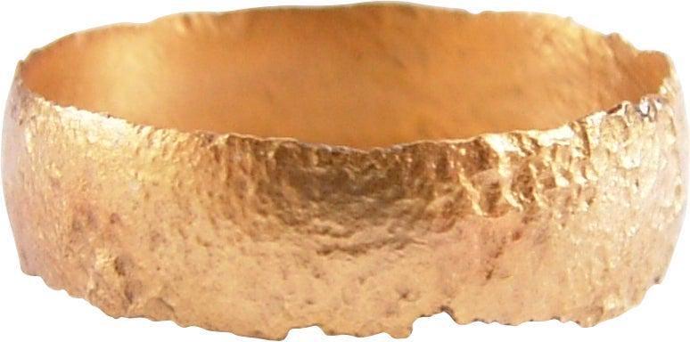 VIKING WEDDING RING, 850-1050 AD, SIZE 9: Late 9th-early 11th century AD. Gilt bronze, size 9. Very broadband, 6.3mm width, with very low rounded face. Surface textured from burial. Professionally refurbished with the 24karat gold surface res