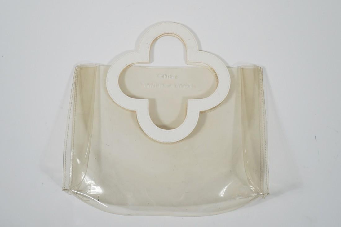 Chloe and Vancleef Vinyl Handbag: Title: Chloe and Vancleef Vinyl Handbag Brand/Designer: Vancleef and chole Materials: Vinyl Dimension: L: 14" W: 3"H: 9" Additional Information: Chloe and Vancleef Vinyl HandbagPreowned items have wea