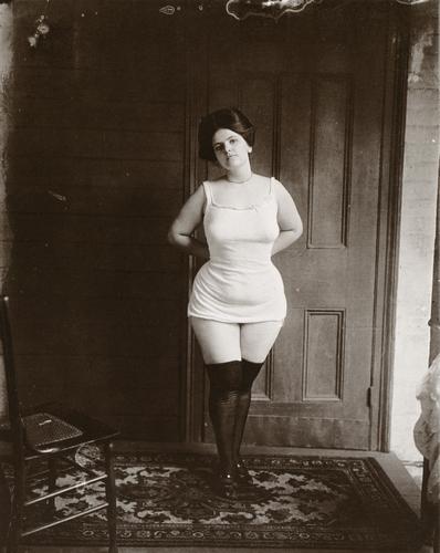 E.J. BELLOCQ - Storyville Prostitute Standing: Artist: E.J. BELLOCQ Title: Storyville Prostitute Standing Medium: Photo Litho, 1978, USA Dimensions: 6.85x8.6" Description: Heat Wax Mounted on 8.5x11" Conservation Board Artist Bio: John Ernest Jose