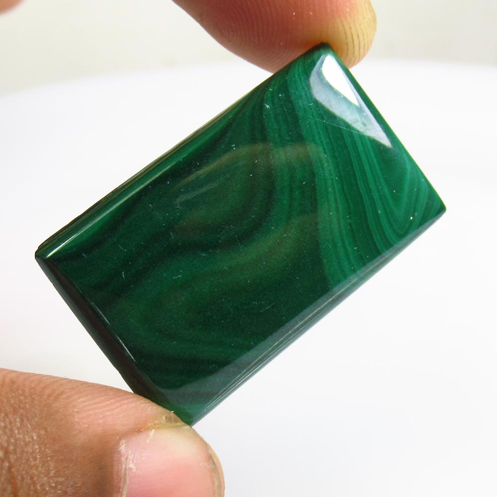 37.29 Ctw Natural Green Malachite Rectangle Cab: No Reserve! Title: 37.29 Ctw Natural Green Malachite Rectangle Cab Stone Clarity: Opaque Gemstones: Malachite Size/Dimensions: 37.29 Carat Weights: 33.00 x 21.00 x 3.50 mm Additional Information: Rect