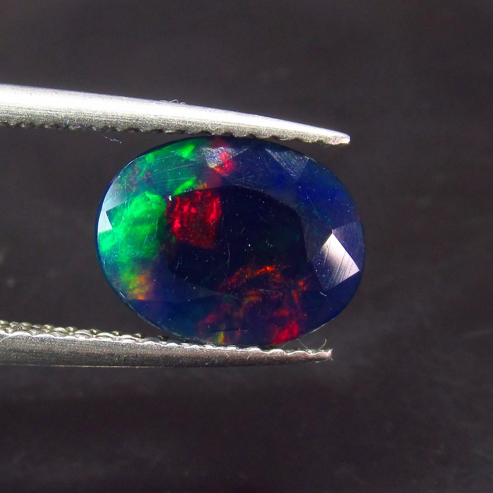 1.41 Ct Natural Ethiopian Black Fire Opal Oval Cut: No Reserve! Title: 1.41 Ct Natural Ethiopian Black Fire Opal Oval Cut Stone Clarity: Translucent Gemstone: Natural Black Opal Carat Weight: 14.41 Size/Dimensions: 10.20 x 7.80 x 4.50 mm Additional Inf