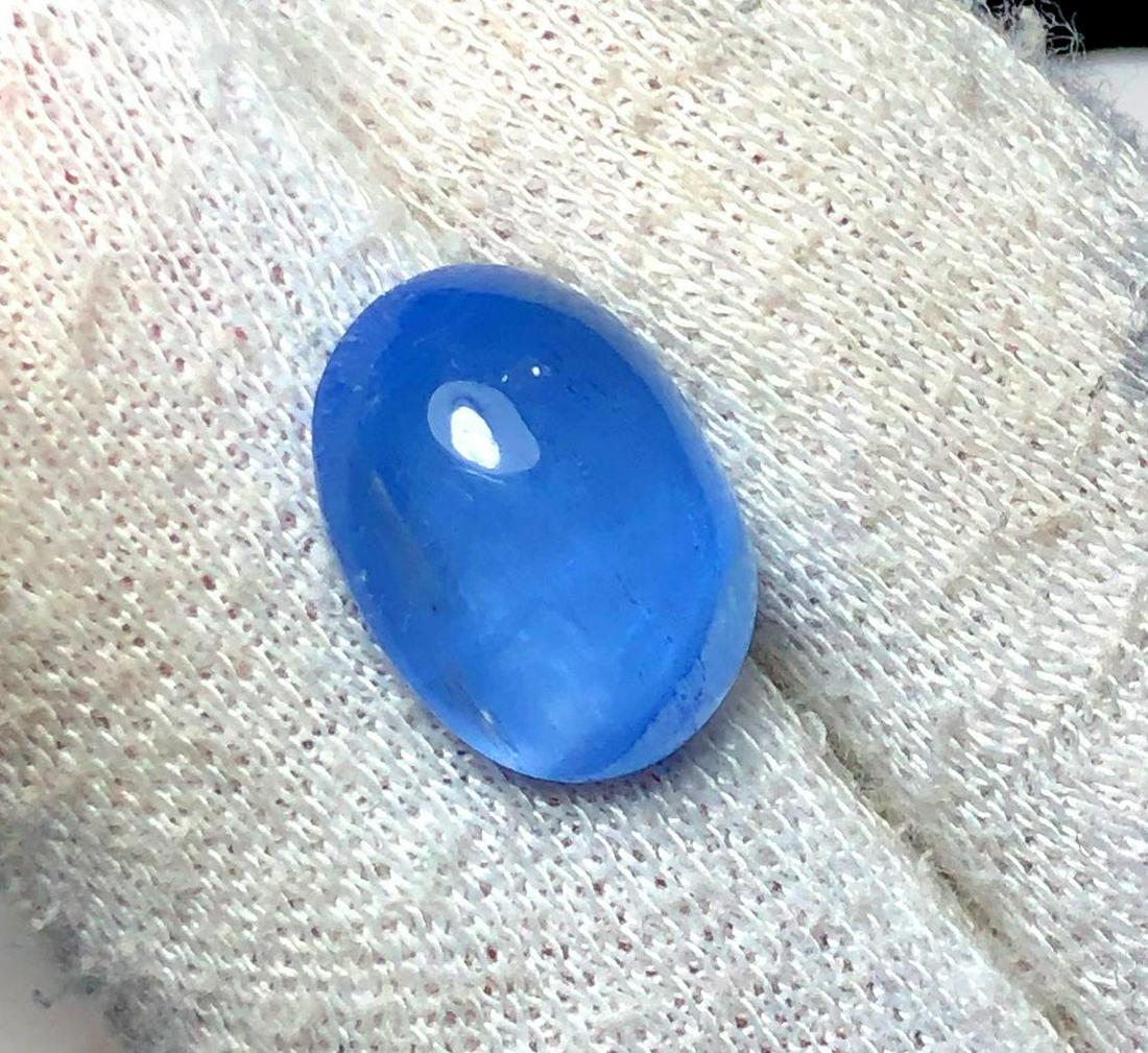 Cat: Materials: Gem type: Aquamarine Carat weight: 8.95 Description Cat's Eye Aquamarine Cabochon Gemstone Navy Blue Color Weight - 8.95 Carats Dimensions - 15.2*11.9*7 mm Treatment : Natural / No Teratmen