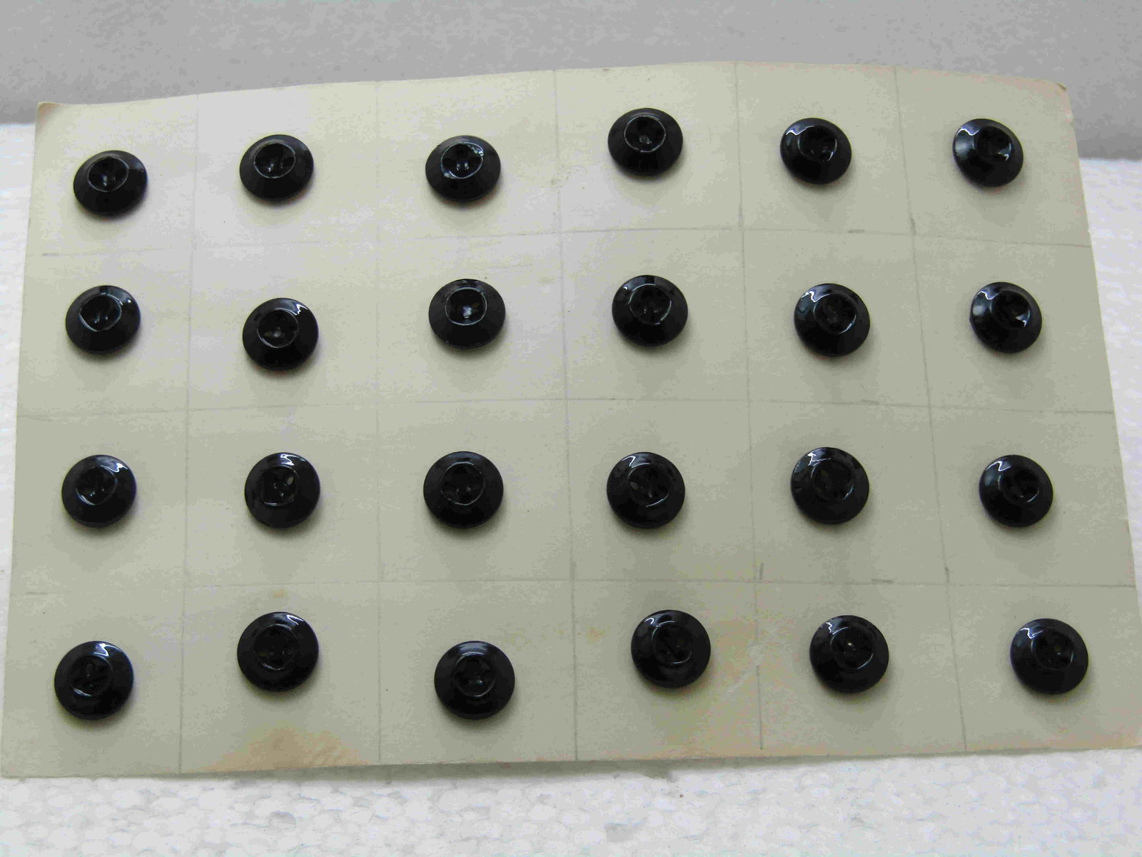 24 Victorian Black Glass Matching Sewing Buttons,: 24 Victorian Black Glass Matching Sewing Buttons, 4-holed, 1/2"Angled edge with recessed center. Late 1800's to very early 1900's. Very good condition. Came from the estate of a collector. (INV W. 158