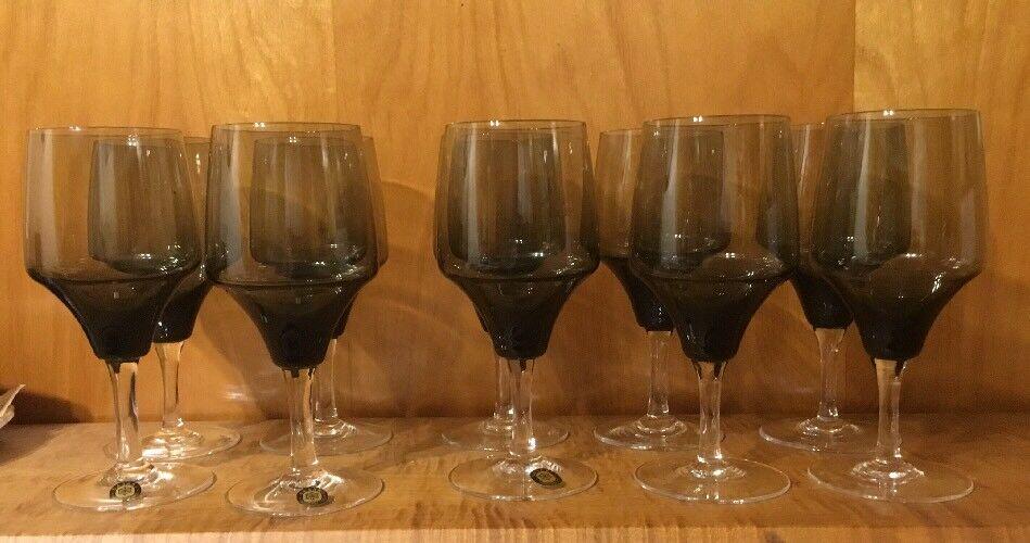 10 Sasaki Smoke Water Goblets: For sale is a lovely set of 10 crystal water goblets by Sasaki Japan. The pattern is called Harmony Smoke. They are approximately 6 7/8” tall and are discontinued. Sasaki labels are still on 3 of th