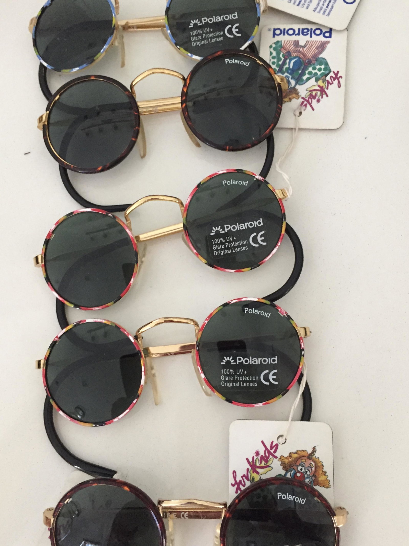 4 pair child Polaroid sunglasses: Title: 4 pair child Polaroid sunglasses Date/Period: 20th Century Materials: Plastic Dimensions: Universal Additional Information: Reflect glare Reserve: $20.00 Shipping: Domestic: Flat-rate of $10.00