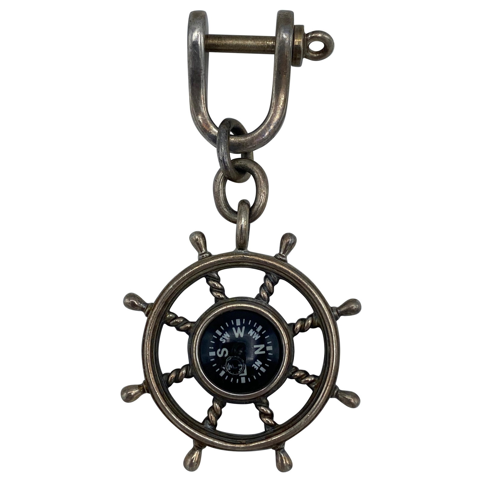 Vintage Tiffany & Co. Sterling Silver and Enamel: 925 sterling silver and enamel compass in the ship's wheel on a key chain with screw in closure, featuring nautical motif designed by Tiffany and Company. Signed by Tiffany & Co., stamped with 925 hal