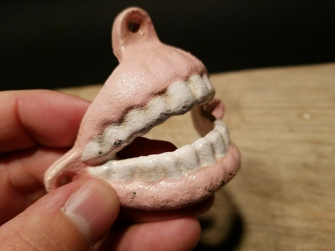 Cast Iron Folk Art Beer Soda Bottle Cap Teeth Opener: Great folk art cast iron bottle opener. This piece was hand painted and aged to look like an antique. Reserve: $15.00 Shipping: Domestic: Flat-rate of $5.00 to anywhere within the contiguous U.S. Inte