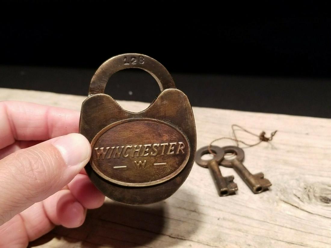 Cast Iron Winchester Firearms Ammo Box Padlock Lock &: 3" tall x 2 1/4" Wide Nice reproduction cast iron winchester padlock! This lock is fully functional! Hard to tell its age. Heavy iron and brass. Great aged patina throughout. Limited quantity availabl
