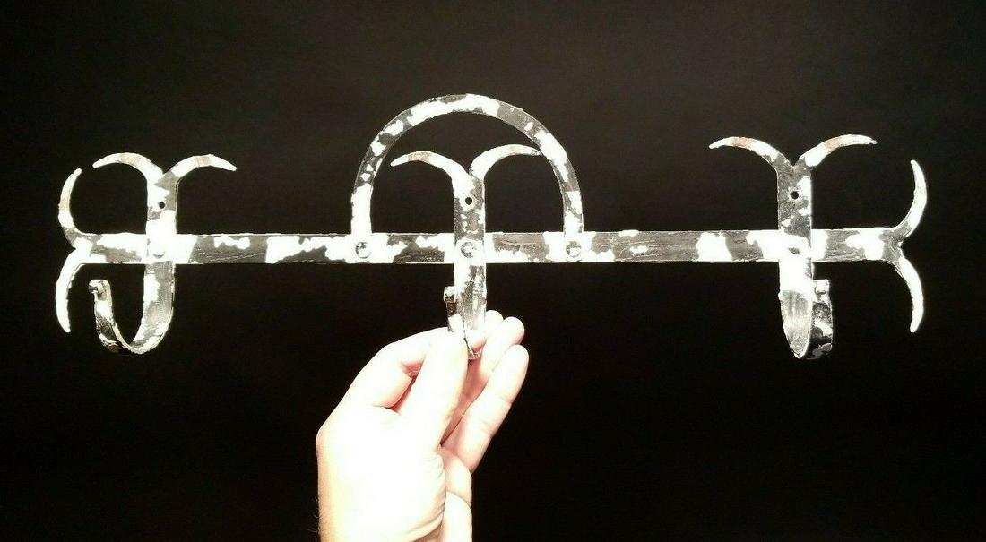 Iron Wall Utensil Herb Coat Hook: (1) Hook 19" wide x 5 1/2" tall 2 5/8" extension Such a nice reproduction hook! A piece such this would have been proudly hung on the wall of a period home to support utensils herbs and game as it wai