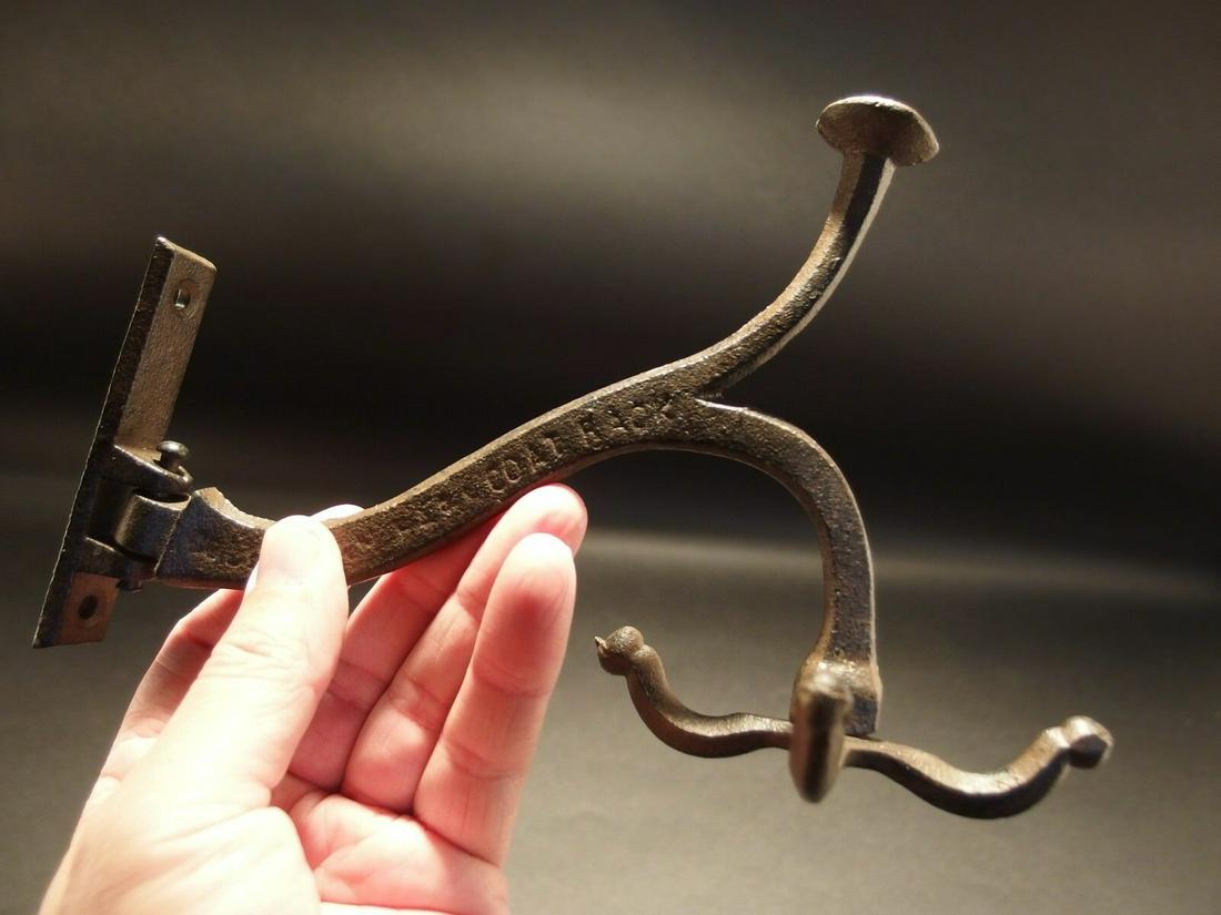 Cast Iron Hook Swivel Bracket Spinning Coat Hanger: 5 1/2" Tall.. 3" Wide 7 1/2" Extension 1 Charming and functional sturdy iron wall hook cast from an antique. Notice not only do the 4 hooks at the end rotate. The entire arm swivels. All Heavy cast ir