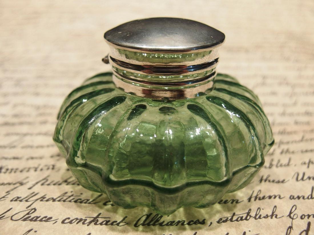 Round Green Glass Glass Inkwell Ink pot Bottle: Charming 2 1/4" High x 3 1/4" wide Charming Reproduction antique green glass inkwell. Very heavy thick glass each with charming subtle signs of being hand made. The hinged shiny lid is nickel plated b