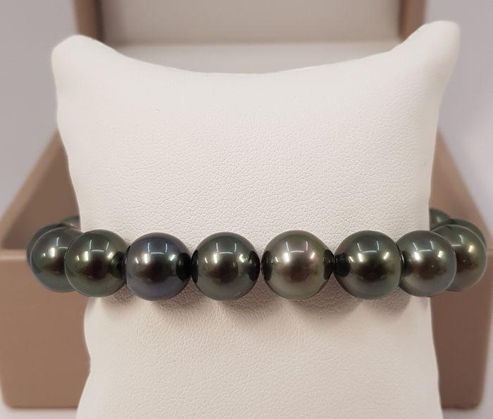 10.5x11.5mm Shimmering Round Tahitian Pearls - Bracelet: Title: 10.5x11.5mm Shimmering Round Tahitian Pearls - Bracelet Description: This beautiful pearl bracelet features a row of lustrous near round peacock Tahitian pearls measuring 10.5x11.5mm. Grown in 