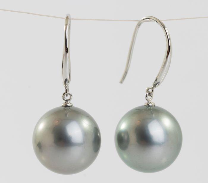 14 kt. White Gold - 11x12mm Round Tahitian Pearls -: Title: 14 kt. White Gold - 11x12mm Round Tahitian Pearls - Earrings Description: Emerging from the tropical lagoons of French Polynesia, these Tahitian pearls have been hand selected for their natural