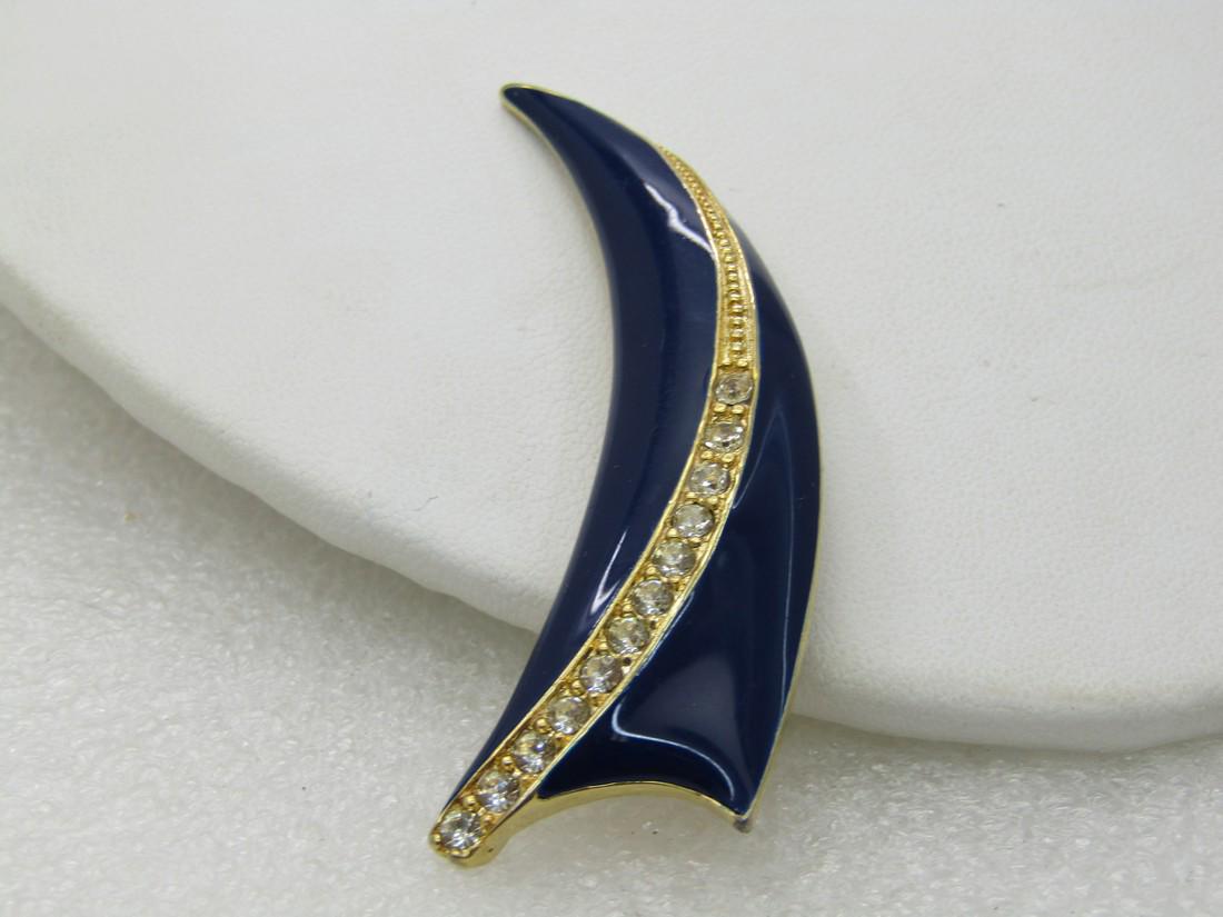 Vintage 1980's Art Deco Enameled Rhinestone Brooch,: Vintage 1980's Art Deco Enameled Rhinestone Brooch, 2.5" by .75" on the wide end and tapers to a point. Curved deep blue enameled with a curved accent through the brooch with pave set clear rhinestone